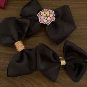 Three large handmade black satin bows